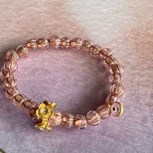 Handmade rose/pink bracelet with mini eye charm.